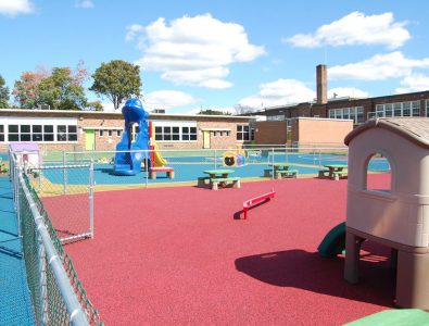 Surfacing transforms a part of a school parking lot.