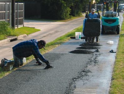 Installing EverTop on walking & jogging trail.