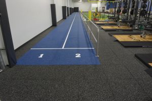 Performance Roll over Performance UltraTiles in fitness facility.