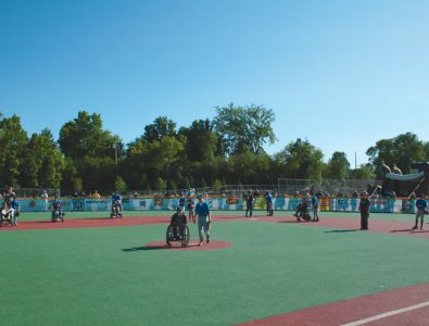 Kids at play on Miracle League baseball field.