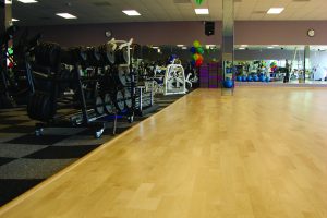 SportWeave carpet tiles under fitness equipment.